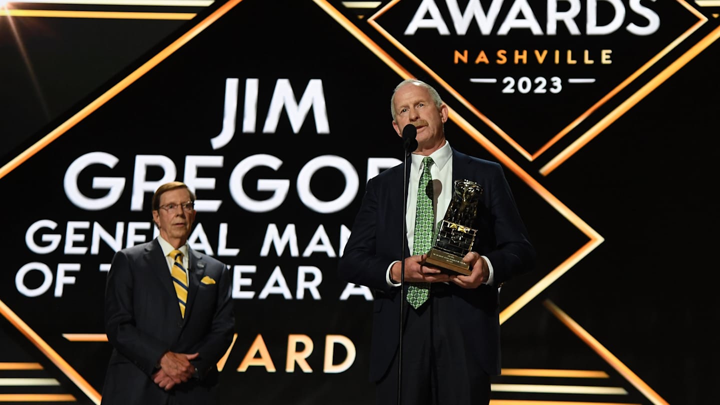 Jun 28, 2023; Nashville, Tennessee, USA; Dallas Stars general manager Jim Nill is awarded the Jim Gregory General Manager of the Year award by Nashville Predators general manager David Poile during the first round of the 2023 NHL Draft at Bridgestone Arena. Mandatory Credit: Christopher Hanewinckel-Imagn Images