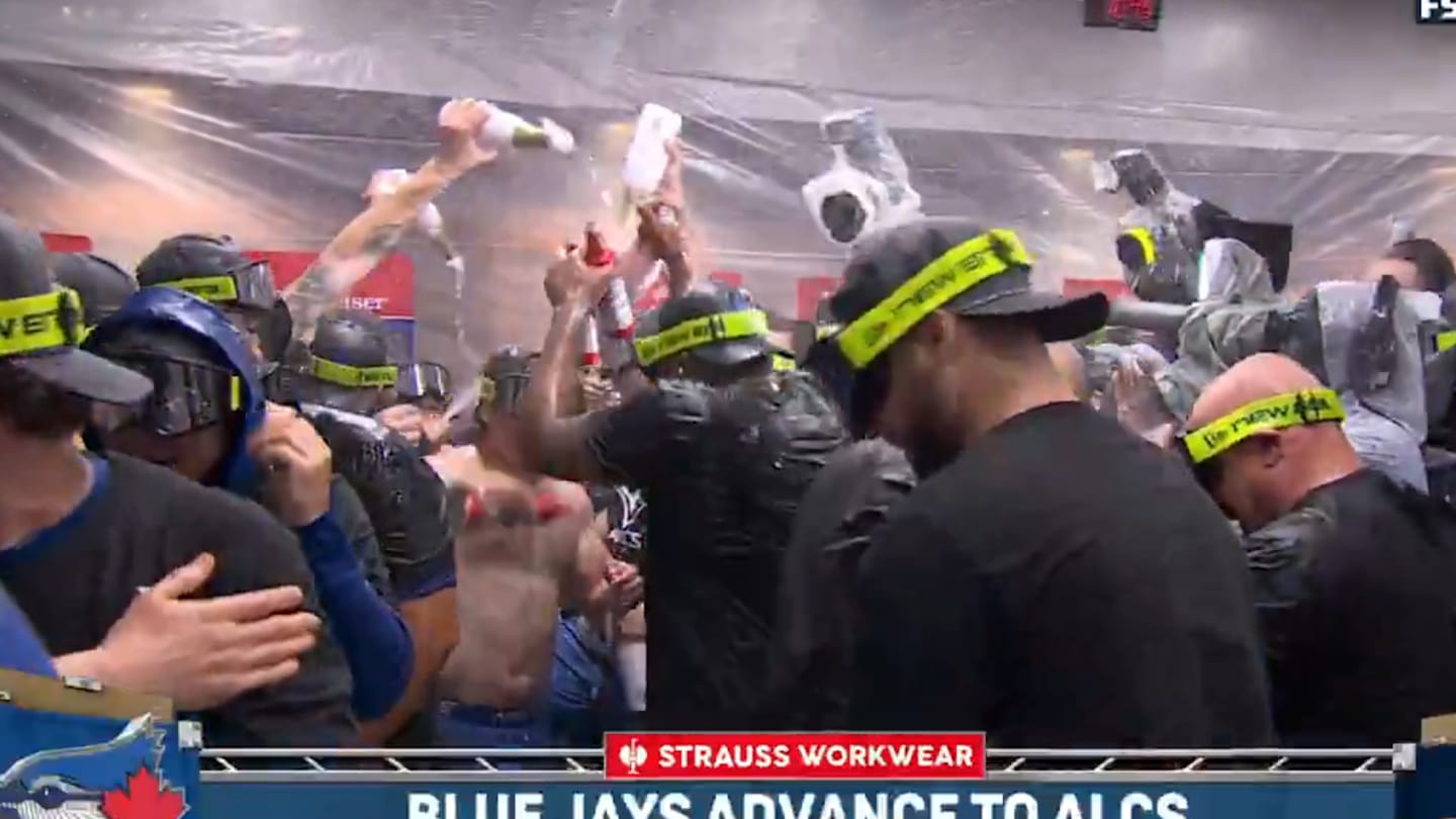 Blue Jays Spray Champagne to 'New York, New York' After Eliminating Yankees in Bronx