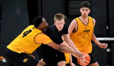 Iowa men’s basketball head coach Ben McCollum passes Bennett Stirtz (14) during practice June 19, 2025 at Carver-Hawkeye Arena in Iowa City, Iowa.