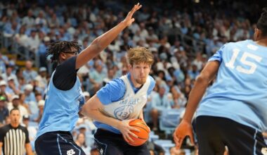 Oct 4, 2025; Charlotte, NC, USA; North Carolina Tar Heels center Henri Veesaar (13) with the ball as forward James Brown (2) defends in the first half at Dean E. Smith Center. Mandatory Credit: Bob Donnan-Imagn Images