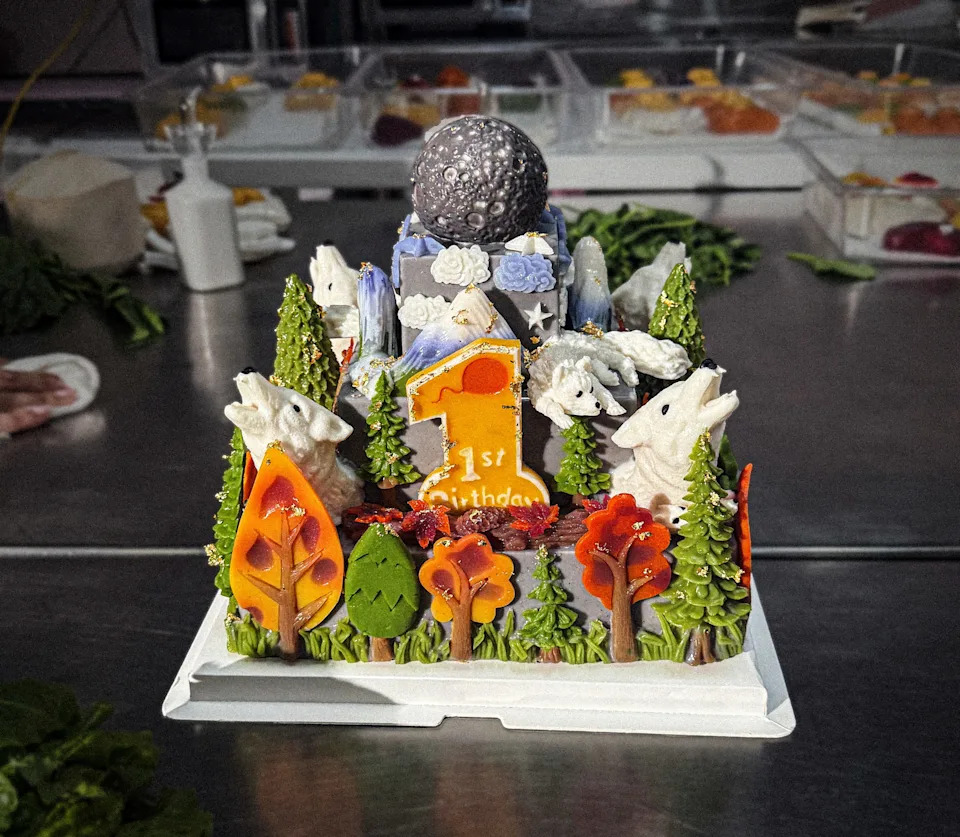 A custom-made dire wolf-themed cake from Mishka Luxury Dog Boutique in San Francisco for the male dire wolves' first birthday.