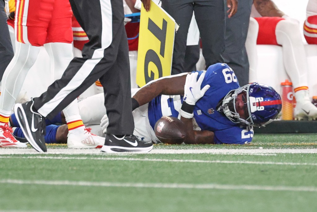 Tyrone Tracy Jr. grabs his shoulder in pain during the Giants-Chiefs game on Sept. 21, 2025. 