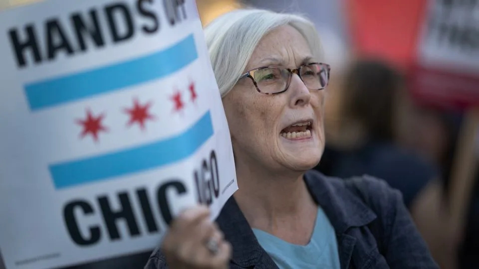 Demonstrators protest downtown in Chicago after recent ICE raids in the city. - Scott Olson/Getty Images
