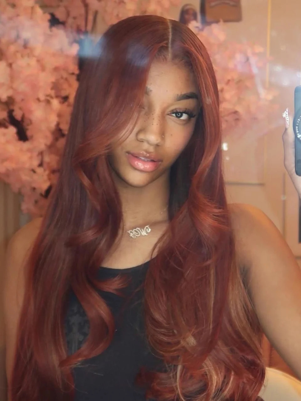 Angel Reese taking a selfie.