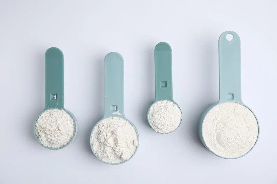 should your teenage boy take creatine? four scoops of white powder on a light plain background.