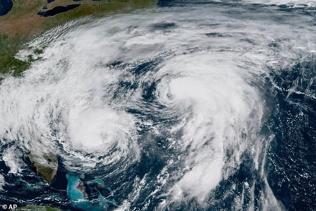 Weather systems in the Atlantic Ocean, Hurricane Imelda, left, and Hurricane Humberto at right