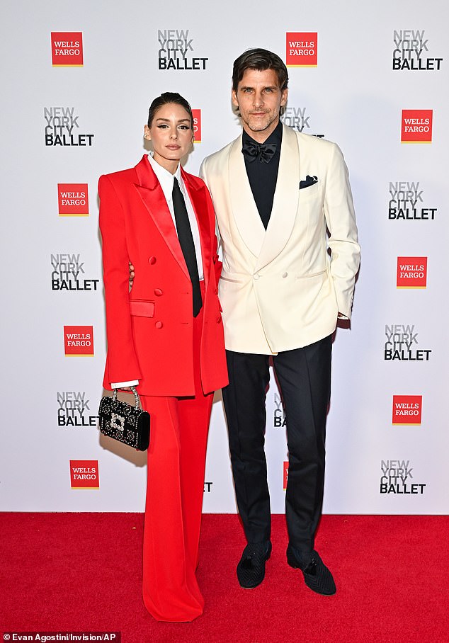 Olivia Palermo suited up for the occasion in NYC with her hunky husband Johannes Huebl