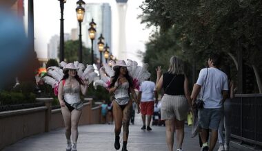 Las Vegas saw 4.56 million passengers visit in August which was a drop of 6 percent compared to the same time last year. Women dressed as showgirls wave to visitors walking along the Las Vegas Strip