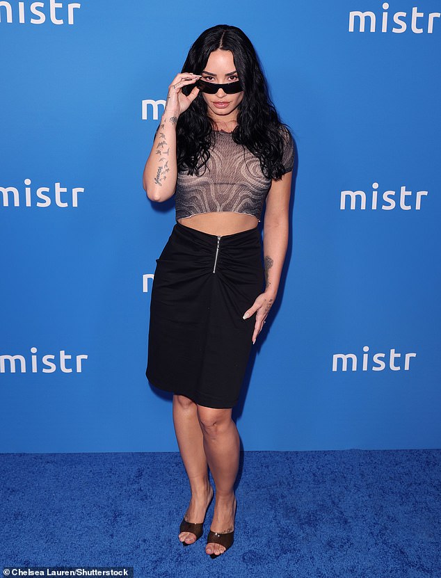 Demi Lovato flashed her toned midriff as she led the stars attending the first-ever National PrEP Day in Los Angeles on Thursday