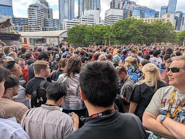 Footage from inside the convention centre showed people rushing towards the doors and spilling onto the pavement outside (pictured)