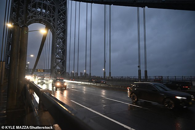 Winds of up to 60mph and heavy rains - reaching between 1.5 and 3 inches - are expected until Monday as stormy weather hit NYC on Sunday afternoon. Pictured: The George Washington Bridge