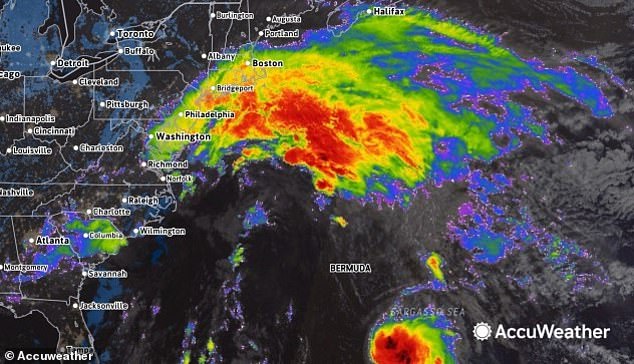 New York is set to be hit with heavy rain - reaching between 1.5 and 3 inches - and winds of up to 60mph, with flood warnings in place through Monday