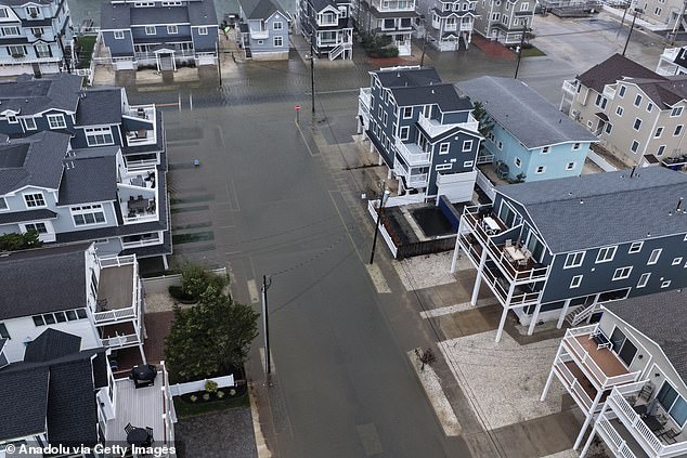 High tides and rainfall were seen flooding Avalon, New Jersey as the storm hit on Sunday