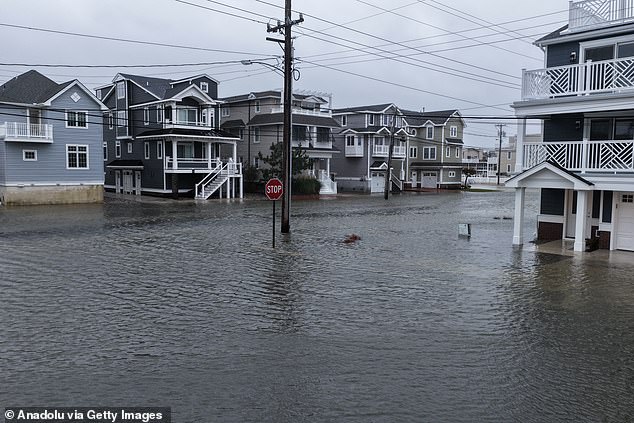 Video in Avalon saw large waves battering New Jersey and lapping over the Townsends Inlet Bridge, as well as streets submerged by the rising water levels