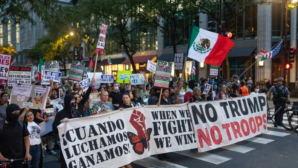 Demonstrators march along the Magnificent Mile protesting the agenda of the Trump administration on September 30. - Scott Olson/Getty Images