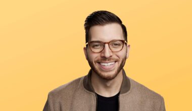 Portrait of financial expert George Kamel on a yellow background