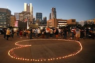 A vigil for the ICE shooting victims was held at City Hall in Dallas, Texas, Friday, October...
