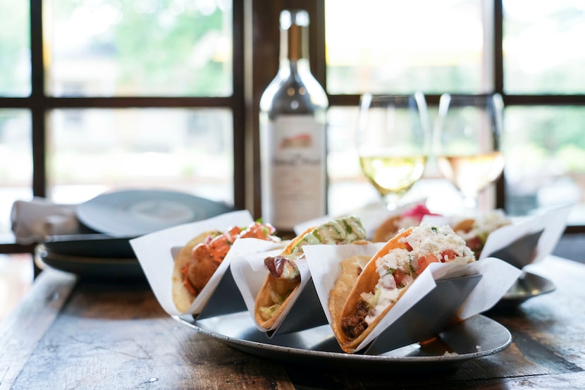 A special of six tacos and a bottle of wine at Taco y Vino.