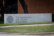 A sign outside of the main entrance to the Dallas Immigration and Customs Enforcement office...