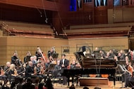 Pianist Bruce Liu acknowledged applause after performing with the Dallas Symphony Orchestra,...