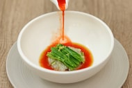 An early favorite at Domodomo Kō in Dallas was the cold fish soup with a kaleidoscope of...