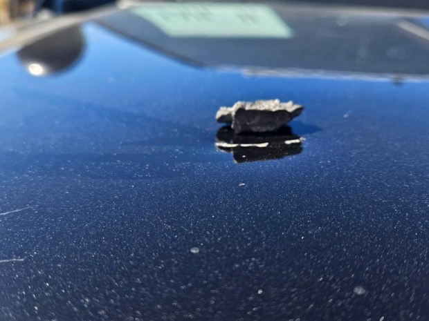 The California Highway Patrol released a photo of a patrol car dented by metal shrapnel near Interstate 5 when an artillery round from Camp Pendleton prematurely detonated during a live-fire exercise Saturday.  (Photo courtesy California Highway Patrol)