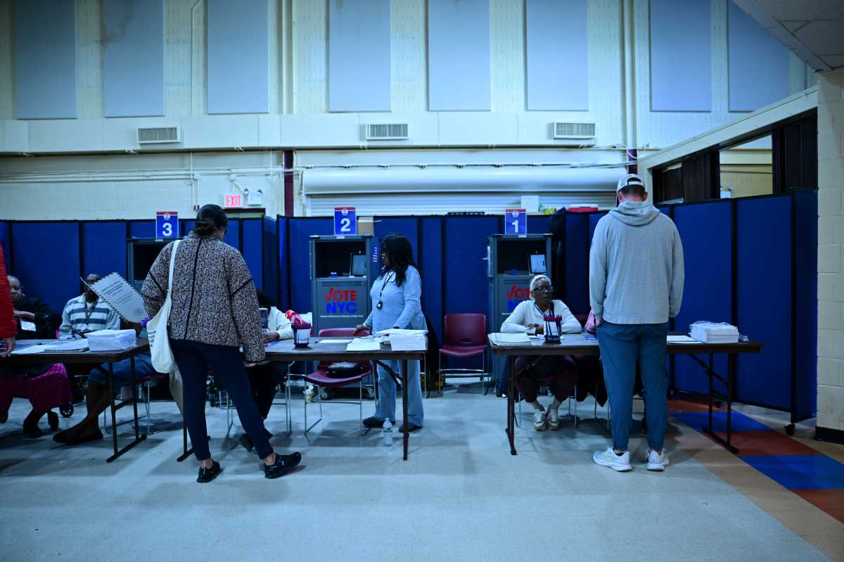 People wait to cast their vote in the general election in Brooklyn on Oct. 25, 2025.
