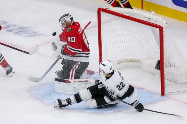 Los Angeles Kings left wing Kevin Fiala (22) falls on the ice while Chicago Blackhawks goaltender Arvid Soderblom (40) blocks a shot during the third period at the United Center Sunday Oct. 26, 2025 in Chicago. (Armando L. Sanchez/Chicago Tribune)