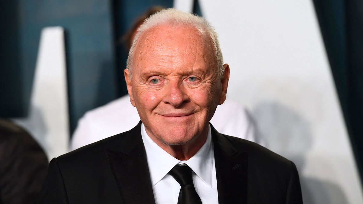 Anthony Hopkins wears black suit