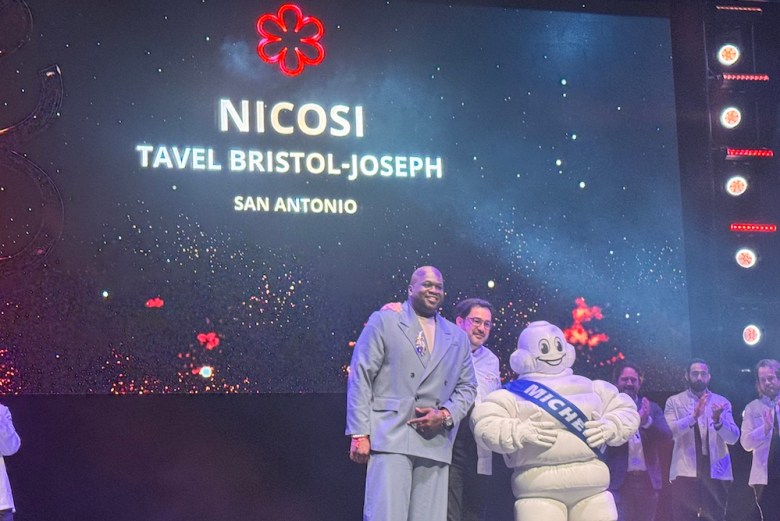 Tavel Bristol-Joseph of San Antonio's Nicosi accepts his restaurant's award.