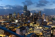 The Dallas skyline lights up as if it was night as totality happens during the total solar...