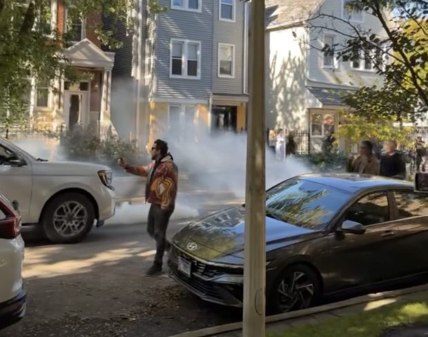 Gas is deployed as a vehicle of federal agents backs down the 3300 block of North Lakewood Avenue in Chicago's Lakeview neighborhood on Oct. 24, 2025. (Alyson Lewis)