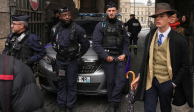The Louvre detective? Mystery dapper 'detective' in AP photo after the Louvre heist creates social media buzz