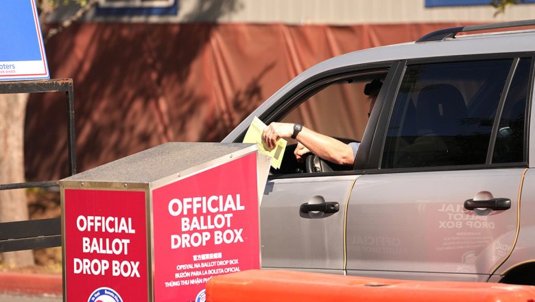 A voter places a ballot in a drop box at the County Registrar of Voters. (Photo by Chris Stone/Stocktonia)