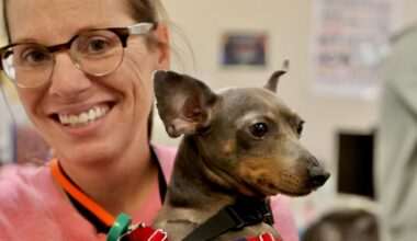 Allison Hussey and a String Theory School therapy dog
