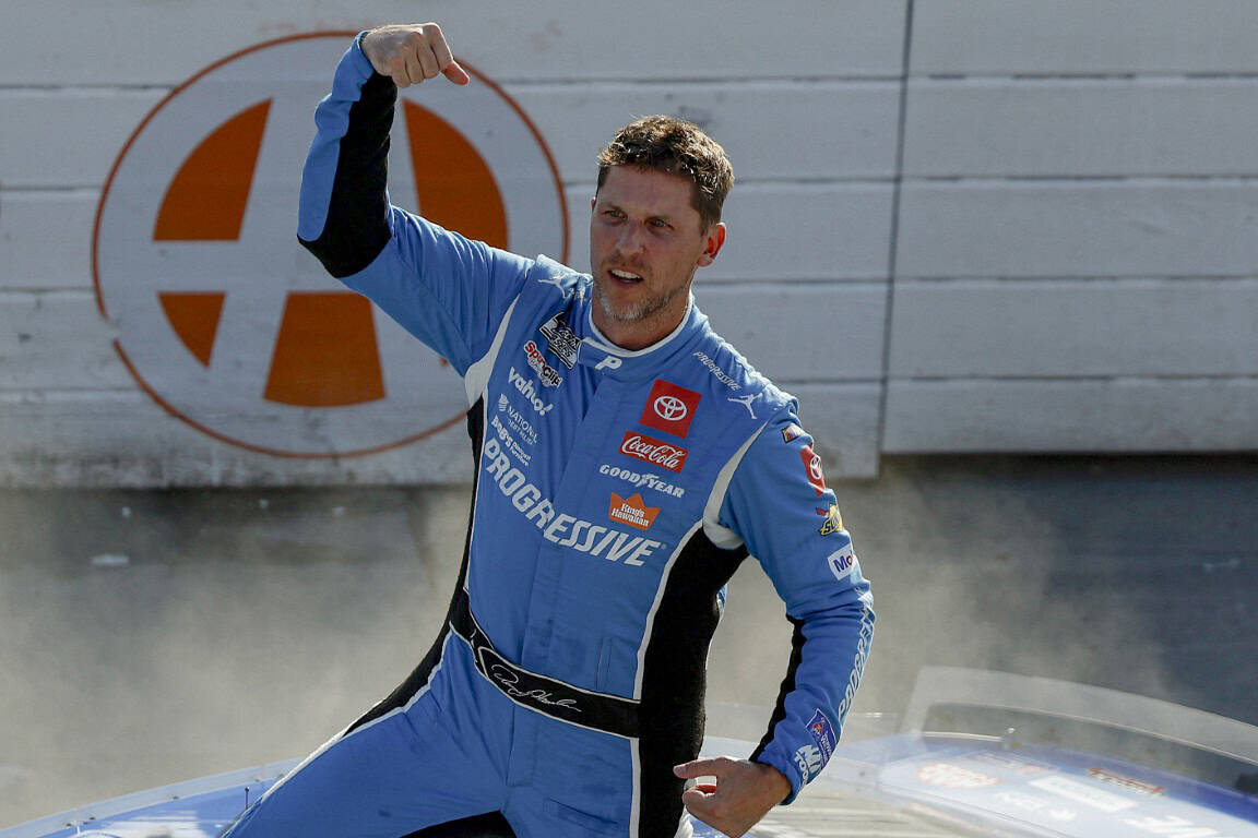 Denny Hamlin, driver of the #11 Progressive Toyota, celebrates after winning the NASCAR Cup Series AutoTrader EchoPark Automotive 400 at Dover Motor Speedway on July 20, 2025 in Dover, Delaware. (Photo by Sean Gardner/Getty Images)