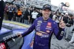 Denny Hamlin, driver of the #11 ampm Toyota, poses with the winner sticker on his car in victory lane after winning the NASCAR Cup Series South Point 400 at Las Vegas Motor Speedway on October 12, 2025 in Las Vegas, Nevada. (Photo by Logan Riely/Getty Images)