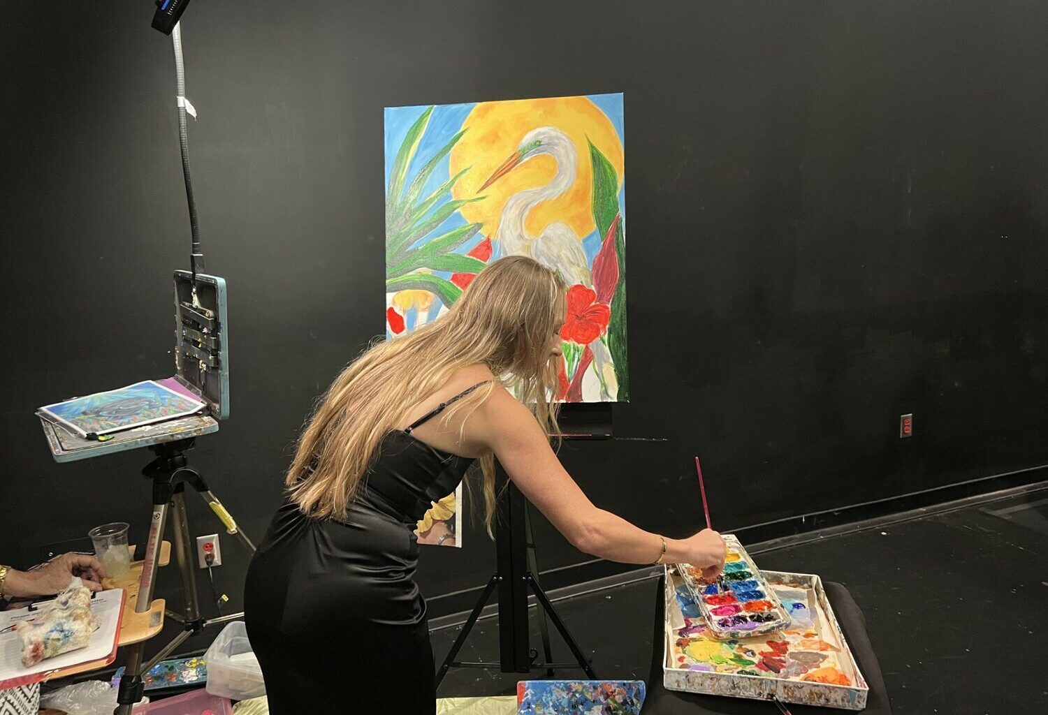 Local artist Beth Haizlip hosted a pop-up studio during the event, where guests could help paint a piece that would be auctioned off.