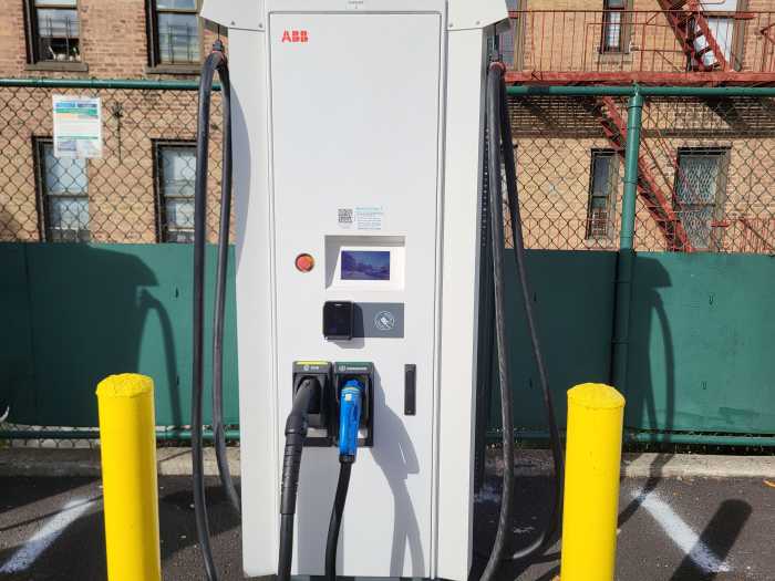 The new public EV charging site has four fast charging kiosks on one side of the lot. Each have two different connectors that are compatible with different vehicle models.