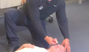 A Phoenix firefighter demonstrates how to administer the overdose-reversal nasal spray naloxone during a media event at Phoenix’s Burton Barr Central Library when the city’s naloxone distribution program launched in August 2023.