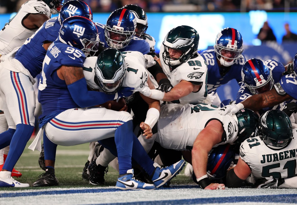 Jalen Hurts #1 of the Philadelphia Eagles crosses the goal line for a touchdown on a tush push during the second quarter of the game against the New York Giants at MetLife Stadium on October 09, 2025 in East Rutherford, New Jersey.