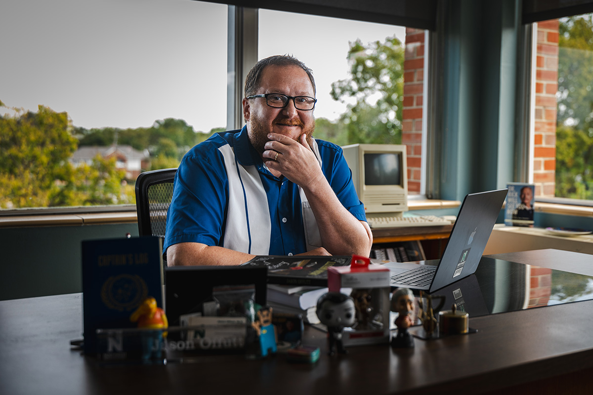 Jason Offutt, pictured in his Wells Hall office, teaches coursework in Northwest's School of Communication and Mass Media. (Photo by Lilly Cook/Northwest Missouri State University)
