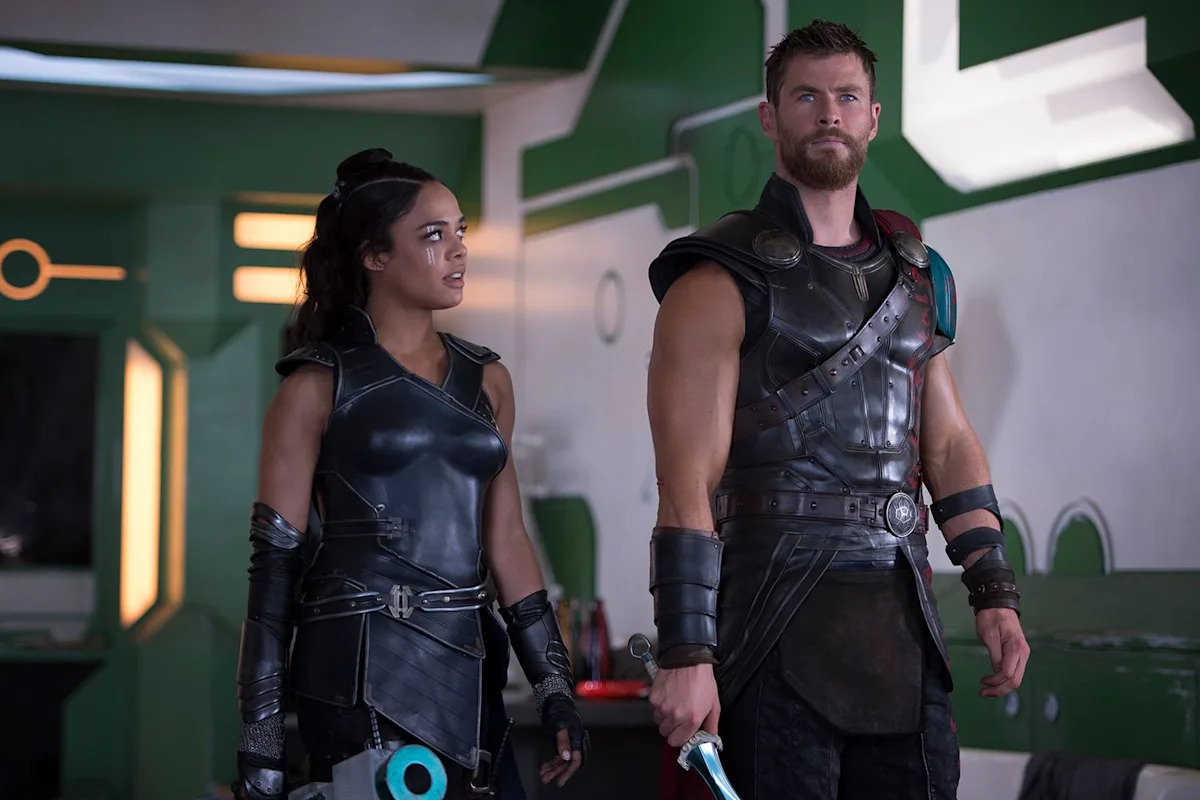 Tessa Thompson says “Thor” costar Chris Hemsworth is like a 'baby with muscles' and 'no inhibition'