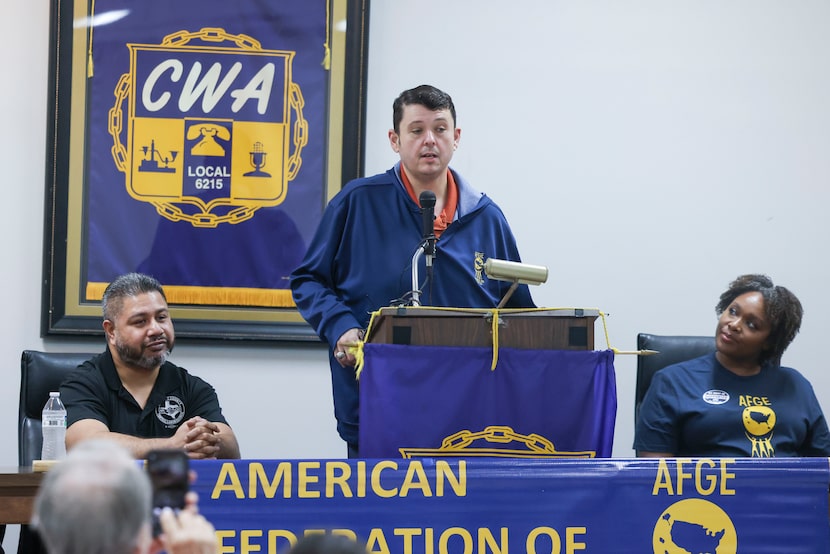 AFGE Council 100 Secretary Treasurer Johnny Jones, speaks during a press conference...
