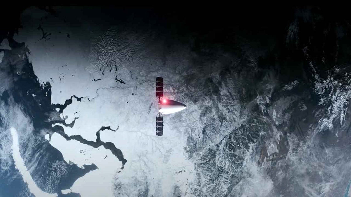 A spacecraft floats above the Earth.