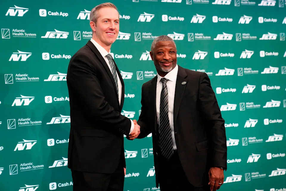 New York Jets General Manager Darren Mougey and Jets Head Coach Aaron Glenn, shake hands as they pose for the press, at the Atlantic Health Jets Training Center, Monday, January 27, 2025, in Florham Park. Mougey and Glenn were introduced to the press in their new positions for the first time.