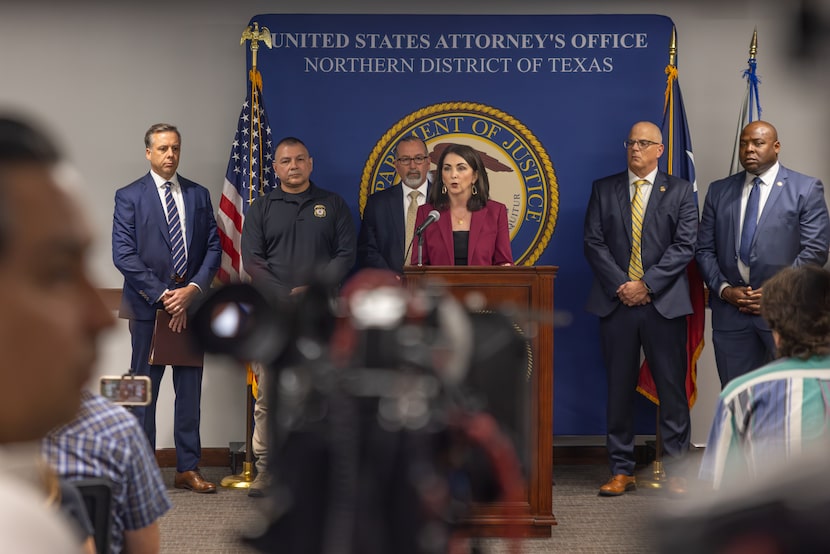 Nancy Larson, the acting U.S. attorney for the Northern District of Texas, speaks at a press...