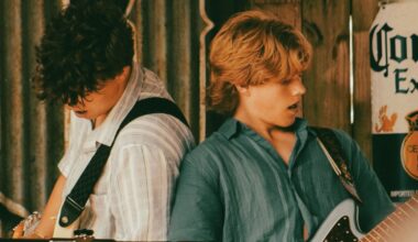 two boys play guitar