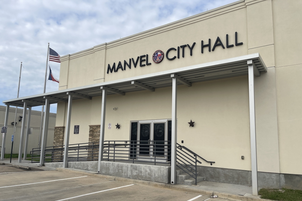 building with sign that reads manvel city hall