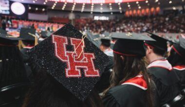 a graduate wear a black cap with the University of Houston logo on it